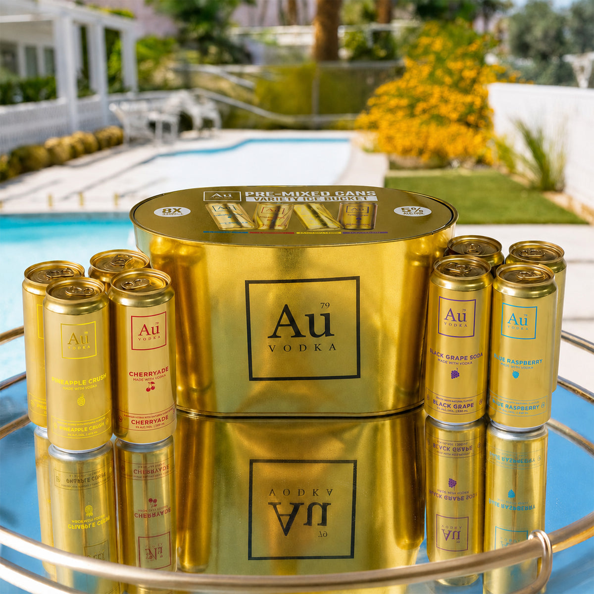 Au Vodka pre-mixed cans variety ice bucket with assorted flavors on a reflective surface by a swimming pool