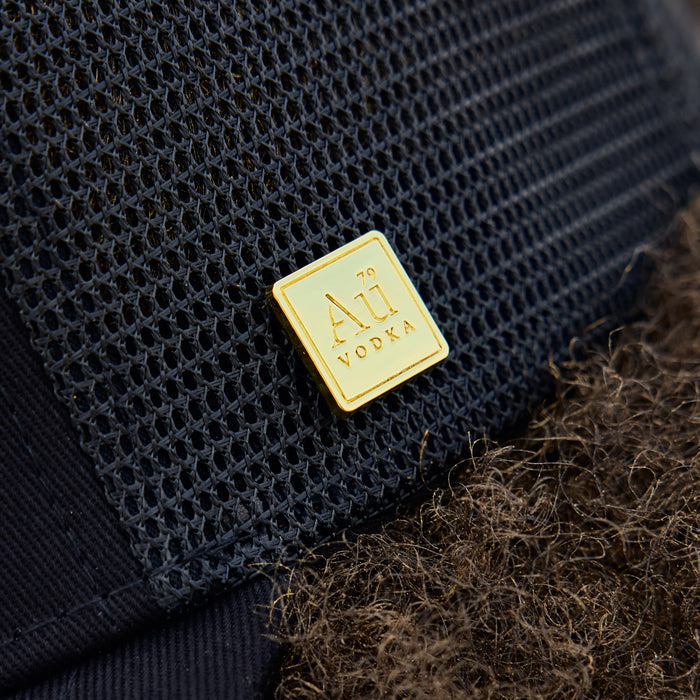 Gold square logo on the side of the cap