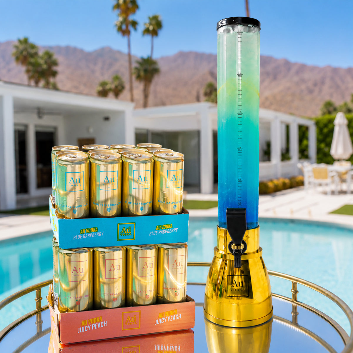 Au Vodka Blue Raspberry and Juicy Peach cans with a blue drink dispenser by a pool
