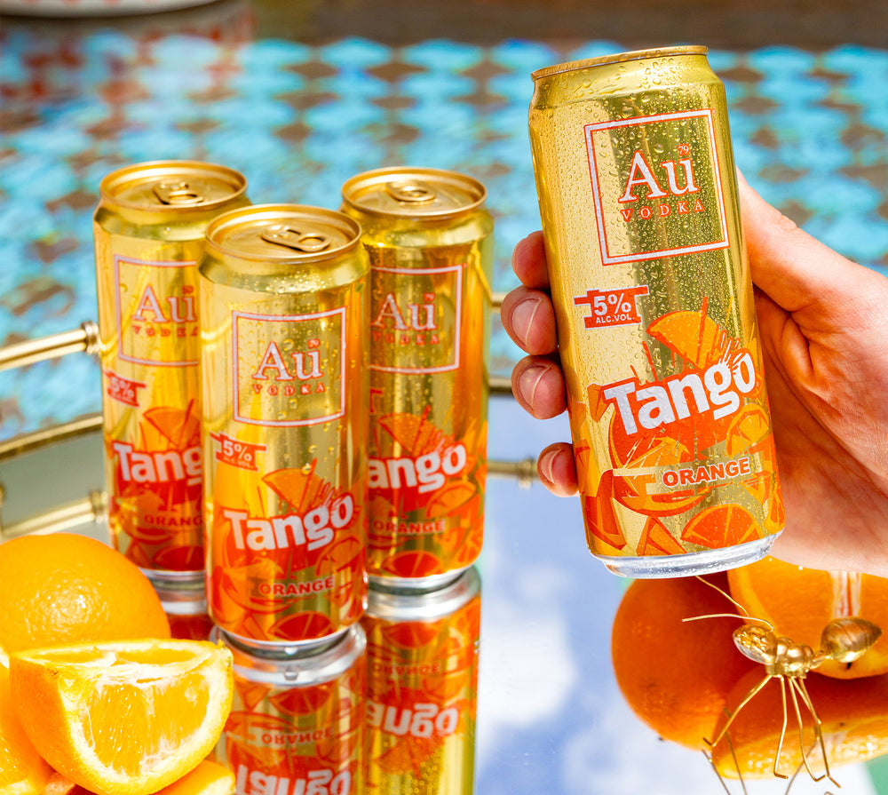 Au vodka x tango orange cans. One can in hand.