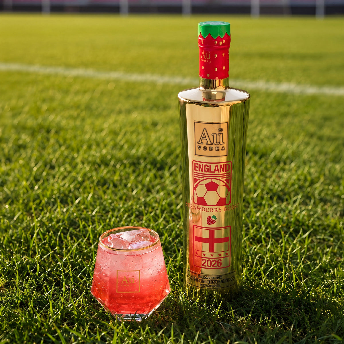 Au Vodka England Strawberry Burst bottle and cocktail on a football pitch